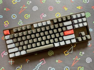 Keychron K8 Pro TKL wireless mechanical keyboard with RGB backlit keys and aluminum frame on a desk