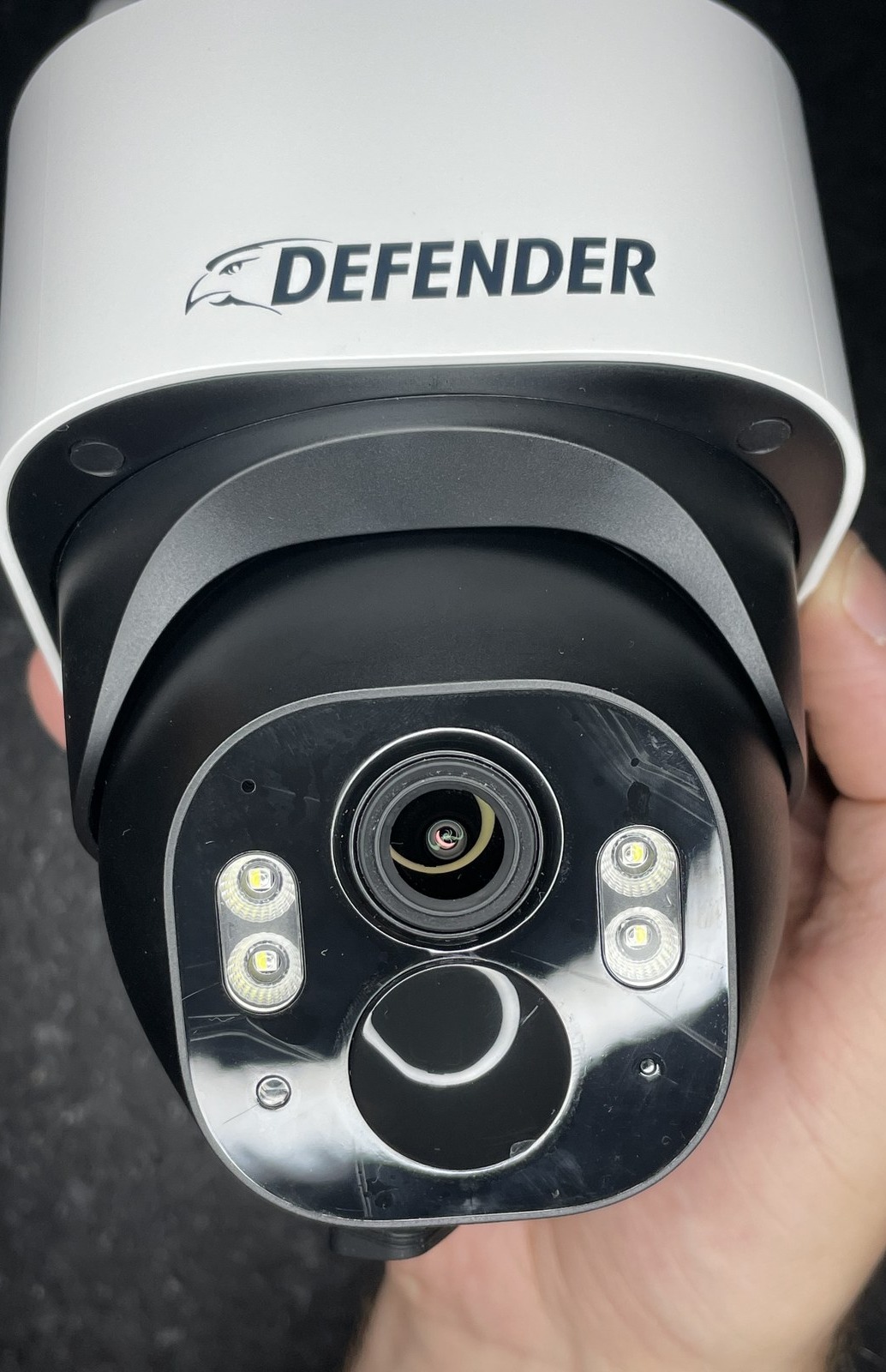 Close-up of the Defender 4G Frontier's lens, dual spotlight LEDs, and built-in microphone