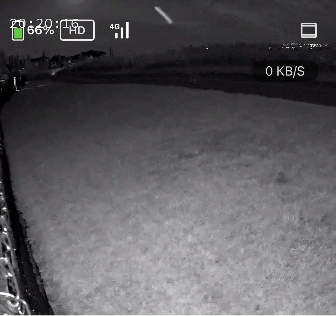 Infrared night vision footage captured mid-pan while using the camera's PTZ controls at night