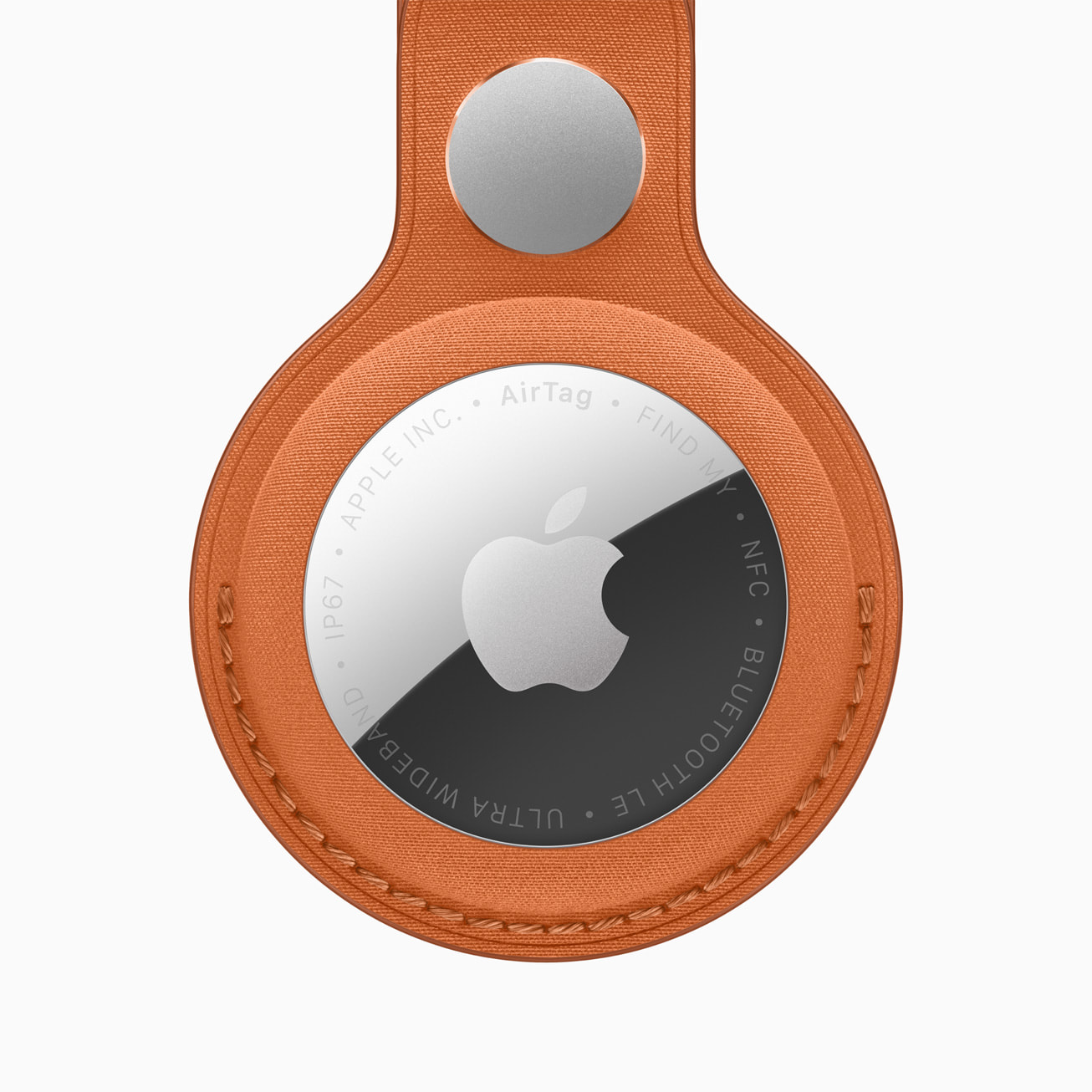 Apple AirTag (2nd Generation) item tracker in an orange FineWoven Key Ring